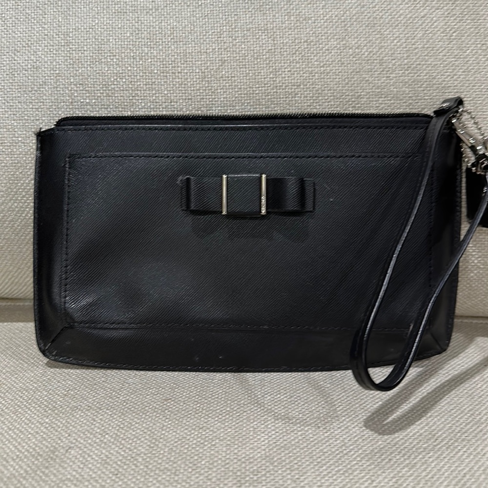 Black Coach wristlet with bow detail